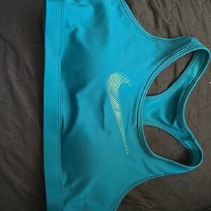 Nike sports bra with padding size large. New with tags. Never worn.